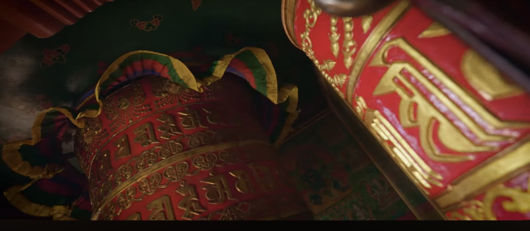 Red and gold prayer drums in Buddhist monastery