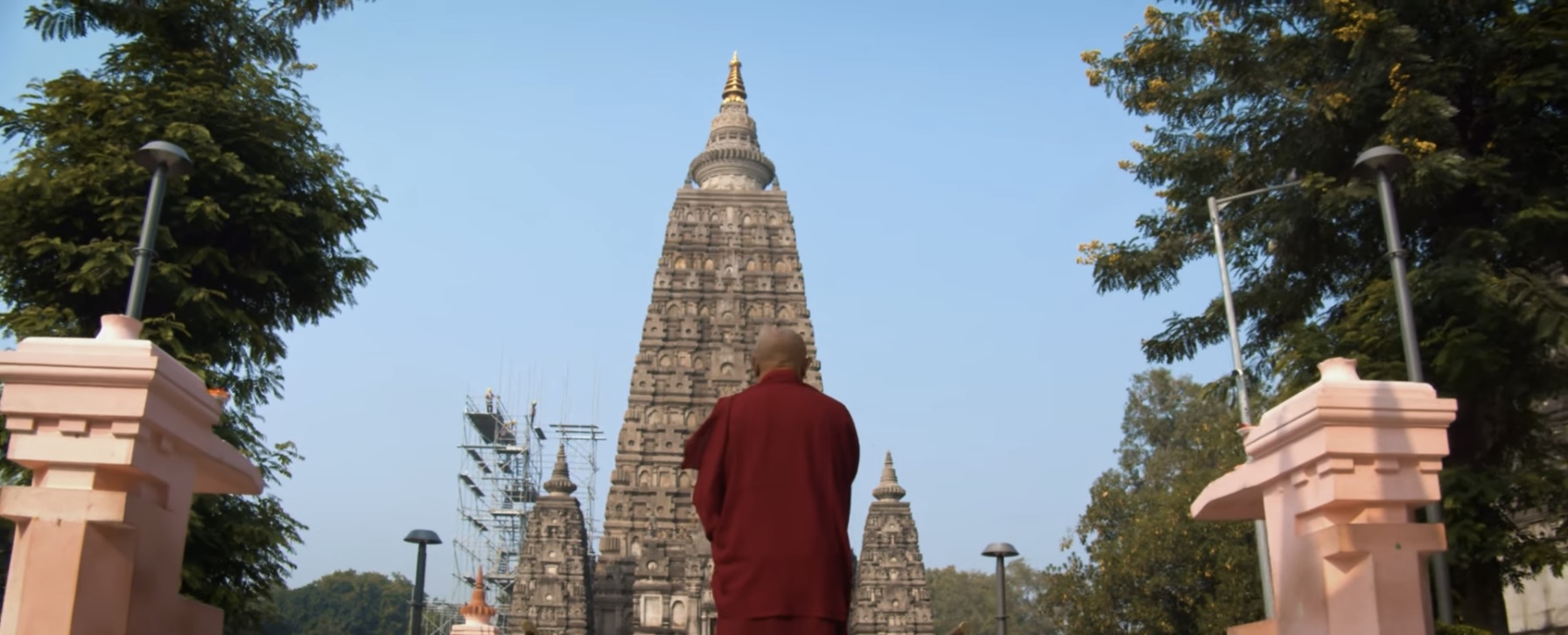 Monk walking towards Mahabodhi Temple at Bodhgaya