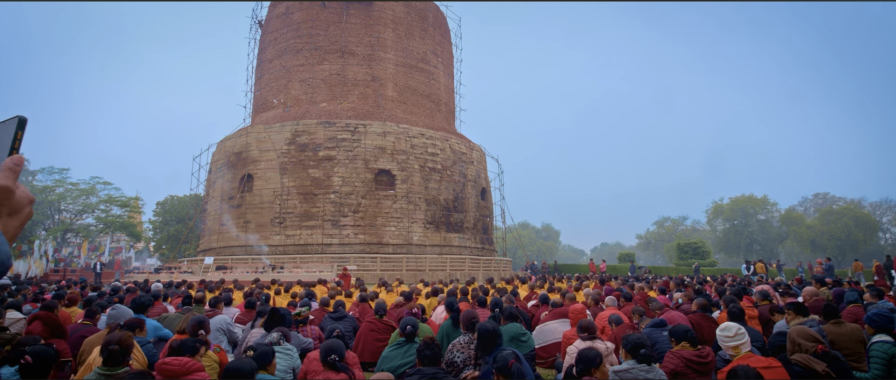 Dhamek Stupa at Sarnath with pilgrims gathered for teachings